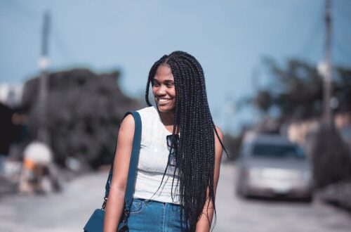 A Woman Wearing a Tank Top and a Denim Skirt